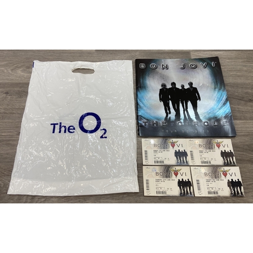 99 - An official tour programme and four tickets from Bon Jovi's 'The Circle Tour 2010-2011.' The tickets... 
