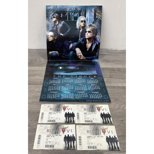 99 - An official tour programme and four tickets from Bon Jovi's 'The Circle Tour 2010-2011.' The tickets... 