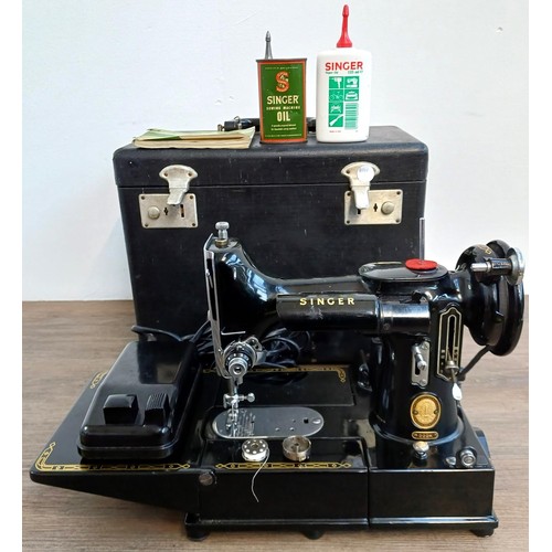 A cased 1955 Singer 222K Featherweight portable electric sewing machine with foot pedal, oil and instruction manual (serial number EK322377) - Only approx. 100,000 222K machines were made between July 1953 and 1961.