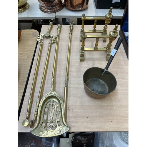 Six items of brassware, one three piece fireplace companion set ...
