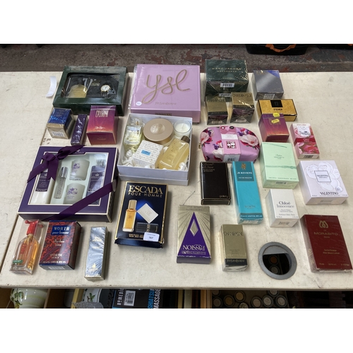 A collection of boxed and packaged toiletries and perfumes to include Elizabeth Taylor's Passion, Escada Pour Homme, Marc Jacobs Decadence, Yves Saint Laurent Parisienne etc.
