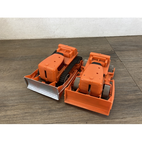 587 - A box containing six toy vehicles to include tinplate Crusader tank - made in Great Britain, Porsche... 