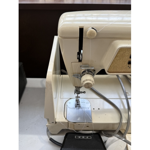 A Singer 670G Golden Panoramic electric sewing machine with foot pedal ...