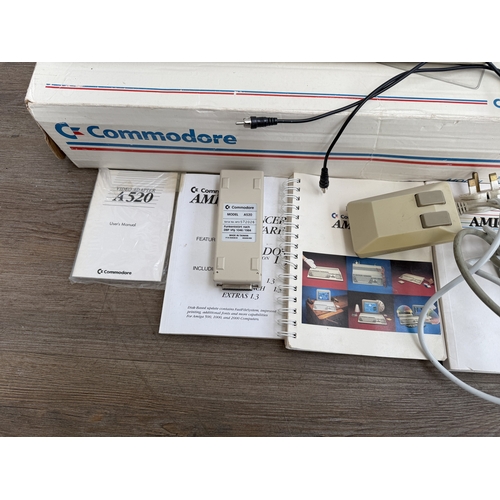 A boxed Commodore Amiga 500 home computer with power adaptor, A520 RF ...