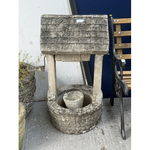 A cast stone wishing well garden ornament - approx. 83cm high x 54cm ...