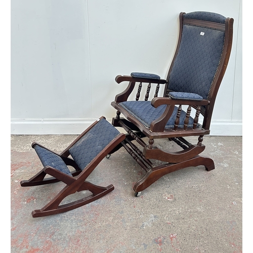 142 - Two pieces of mid/late 20th century mahogany and blue fabric upholstered furniture, one gout stool a... 