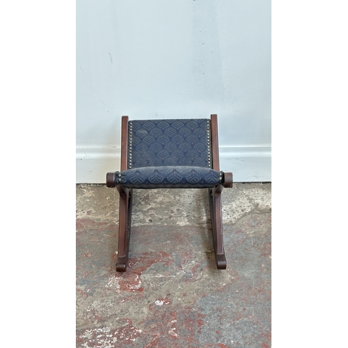 142 - Two pieces of mid/late 20th century mahogany and blue fabric upholstered furniture, one gout stool a... 