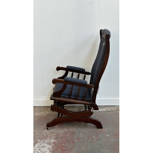 142 - Two pieces of mid/late 20th century mahogany and blue fabric upholstered furniture, one gout stool a... 