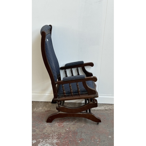 142 - Two pieces of mid/late 20th century mahogany and blue fabric upholstered furniture, one gout stool a... 