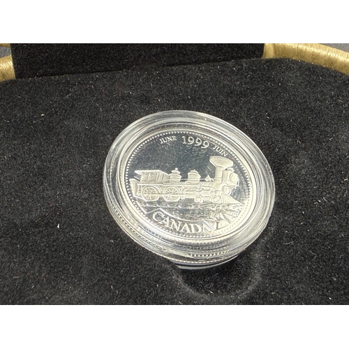 2338 - Two cased Canadian silver coins, one 92.5% 1999 proof 25 cents and one 50% 1976 dollar