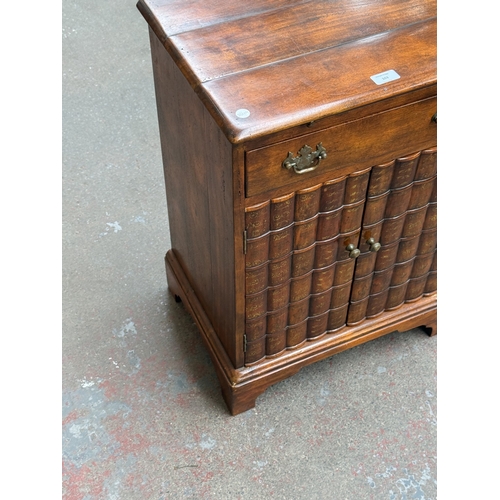 103 - A Theodore Alexander mahogany faux book front side cabinet - approx. 70cm high x 51cm wide x 37cm de... 