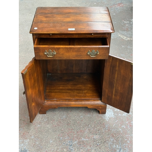 103 - A Theodore Alexander mahogany faux book front side cabinet - approx. 70cm high x 51cm wide x 37cm de... 