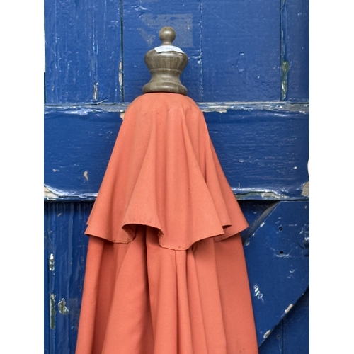 112 - Two garden parasols, one grey metal and beige fabric and one wood and orange fabric - approx. larges... 