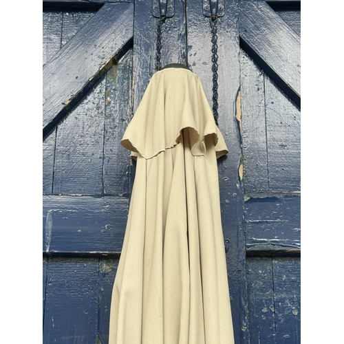 112 - Two garden parasols, one grey metal and beige fabric and one wood and orange fabric - approx. larges... 