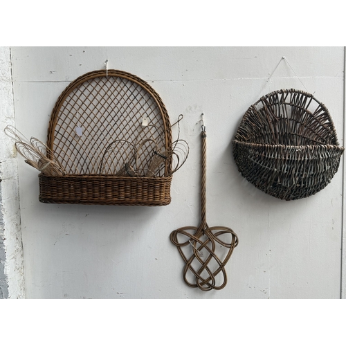 113 - Six wicker items, one carpet beater and five hanging baskets - approx. largest 65cm high x 62cm wide... 