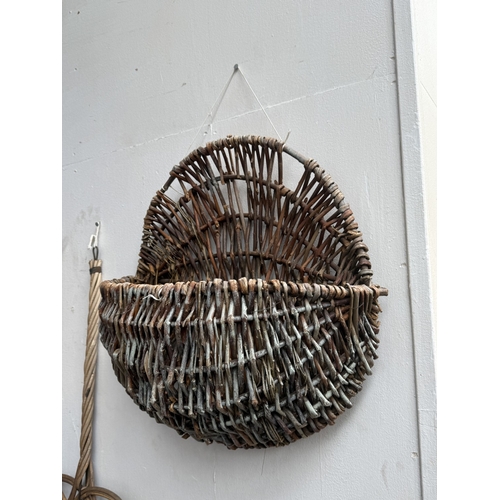 113 - Six wicker items, one carpet beater and five hanging baskets - approx. largest 65cm high x 62cm wide... 