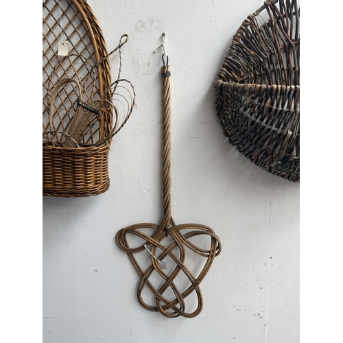113 - Six wicker items, one carpet beater and five hanging baskets - approx. largest 65cm high x 62cm wide... 