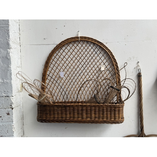 113 - Six wicker items, one carpet beater and five hanging baskets - approx. largest 65cm high x 62cm wide... 