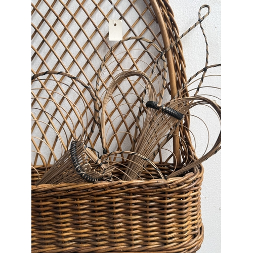 113 - Six wicker items, one carpet beater and five hanging baskets - approx. largest 65cm high x 62cm wide... 