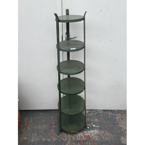 122 - A green metal six tier plant stand - approx. 126cm high