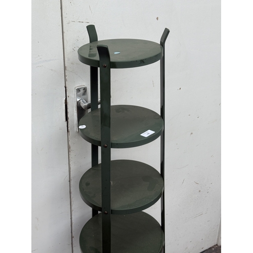 122 - A green metal six tier plant stand - approx. 126cm high