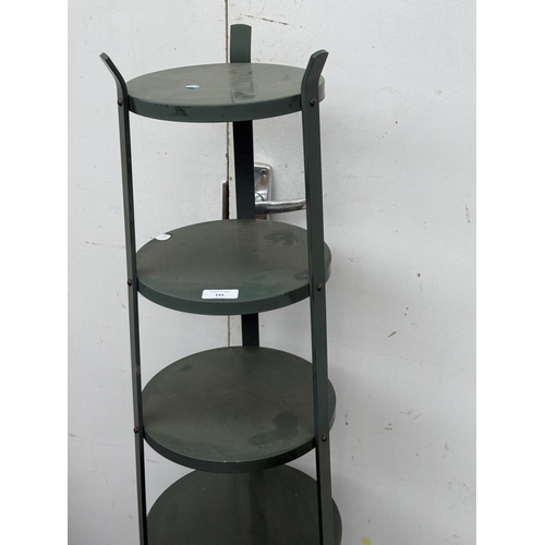 122 - A green metal six tier plant stand - approx. 126cm high