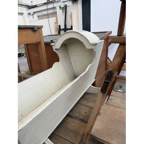 128 - Three pieces of furniture, one mid 20th century beech child's school desk, one antique white painted... 