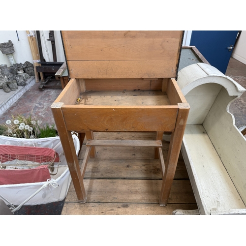 128 - Three pieces of furniture, one mid 20th century beech child's school desk, one antique white painted... 