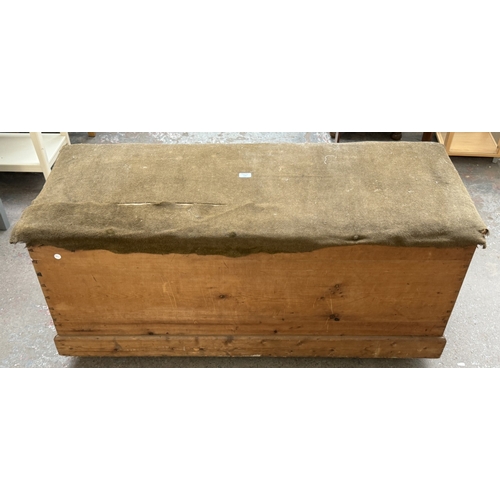 129 - A late 19th/early 20th century pine and fabric top blanket box - approx. 62cm high x 134cm wide x 53... 