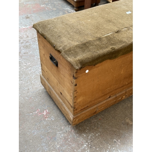 129 - A late 19th/early 20th century pine and fabric top blanket box - approx. 62cm high x 134cm wide x 53... 