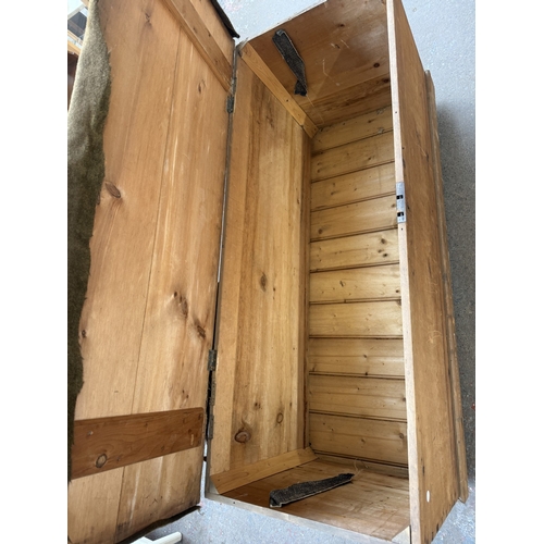 129 - A late 19th/early 20th century pine and fabric top blanket box - approx. 62cm high x 134cm wide x 53... 