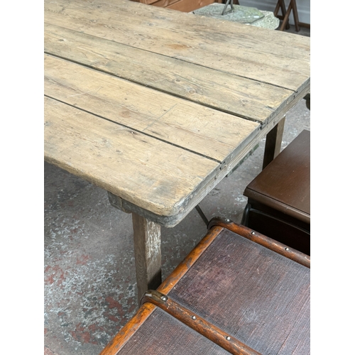 130 - An early 20th century pine folding trestle table - approx. 72cm high x 85cm wide x 182cm long
