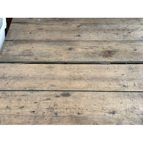 130 - An early 20th century pine folding trestle table - approx. 72cm high x 85cm wide x 182cm long