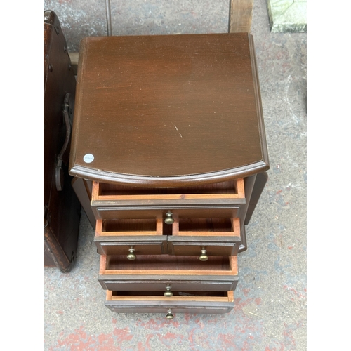 131 - Two pieces of furniture, one early 20th century brown painted and wooden banded travel trunk and one... 