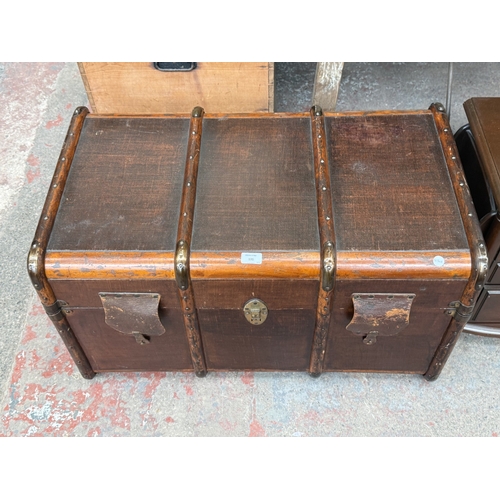 131 - Two pieces of furniture, one early 20th century brown painted and wooden banded travel trunk and one... 