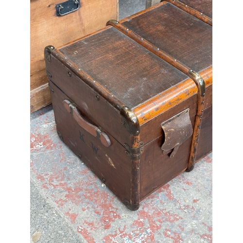 131 - Two pieces of furniture, one early 20th century brown painted and wooden banded travel trunk and one... 