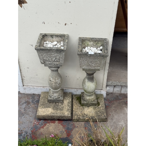 136 - A pair of 19th century style cast stone pedestal garden planters - approx. 70cm high x 30cm wide x 3... 