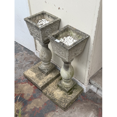 136 - A pair of 19th century style cast stone pedestal garden planters - approx. 70cm high x 30cm wide x 3... 