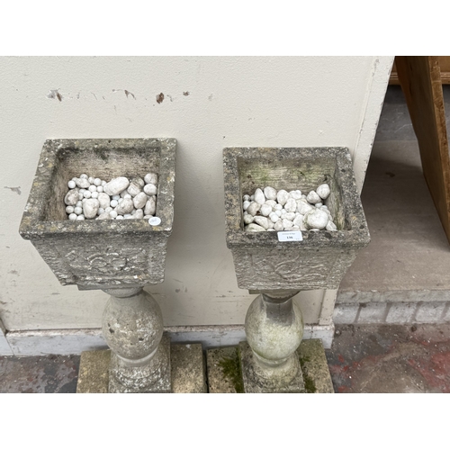 136 - A pair of 19th century style cast stone pedestal garden planters - approx. 70cm high x 30cm wide x 3... 