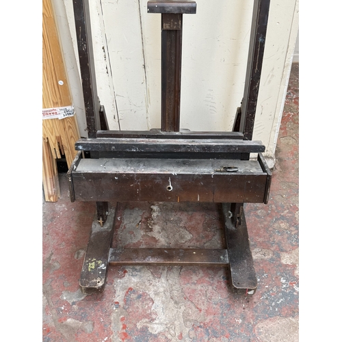 139 - A mid/late 20th century Victorian style stained beech artist's easel with later wooden canvas frame ... 