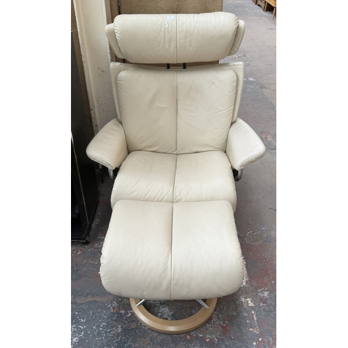 141 - An Ekornes Stressless Magic cream leather and bentwood swivel reclining armchair and footstool - app... 