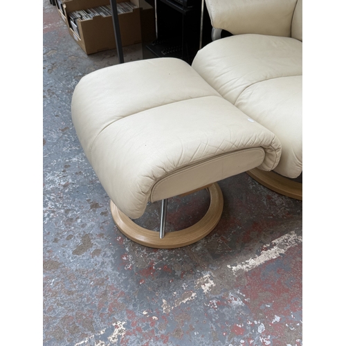 141 - An Ekornes Stressless Magic cream leather and bentwood swivel reclining armchair and footstool - app... 