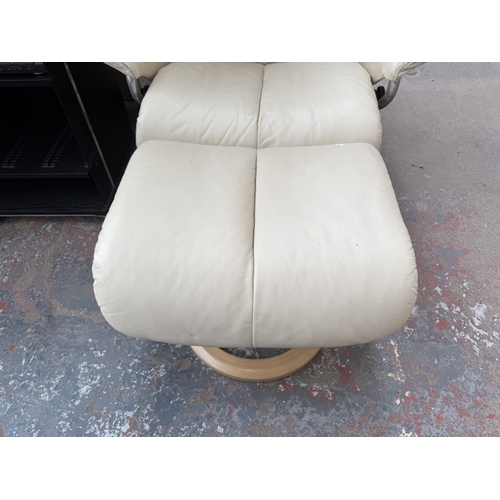 141 - An Ekornes Stressless Magic cream leather and bentwood swivel reclining armchair and footstool - app... 