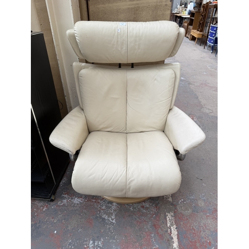 141 - An Ekornes Stressless Magic cream leather and bentwood swivel reclining armchair and footstool - app... 