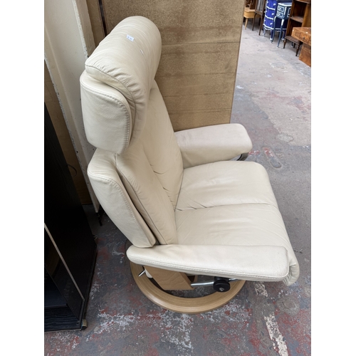 141 - An Ekornes Stressless Magic cream leather and bentwood swivel reclining armchair and footstool - app... 