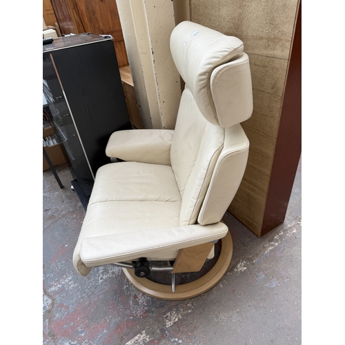 141 - An Ekornes Stressless Magic cream leather and bentwood swivel reclining armchair and footstool - app... 