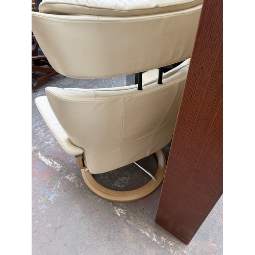 141 - An Ekornes Stressless Magic cream leather and bentwood swivel reclining armchair and footstool - app... 