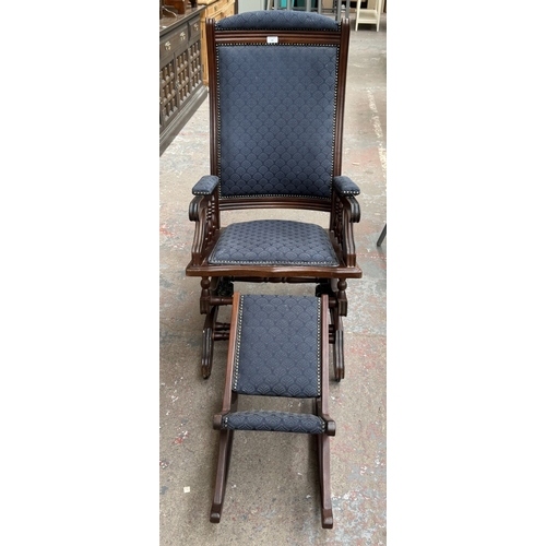 142 - Two pieces of mid/late 20th century mahogany and blue fabric upholstered furniture, one gout stool a... 