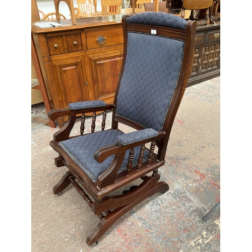 142 - Two pieces of mid/late 20th century mahogany and blue fabric upholstered furniture, one gout stool a... 