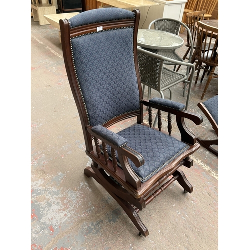 142 - Two pieces of mid/late 20th century mahogany and blue fabric upholstered furniture, one gout stool a... 